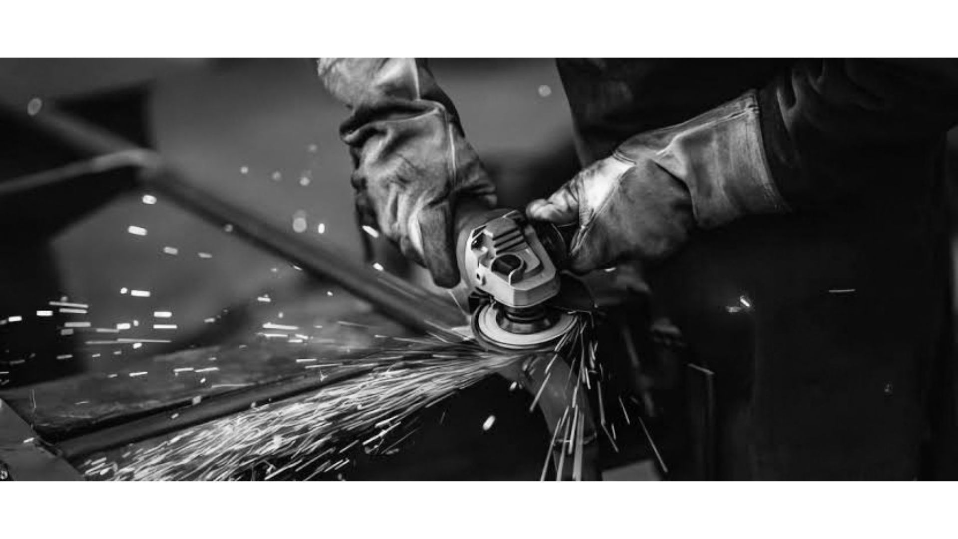 worker grinding weld seam metal chair frame
